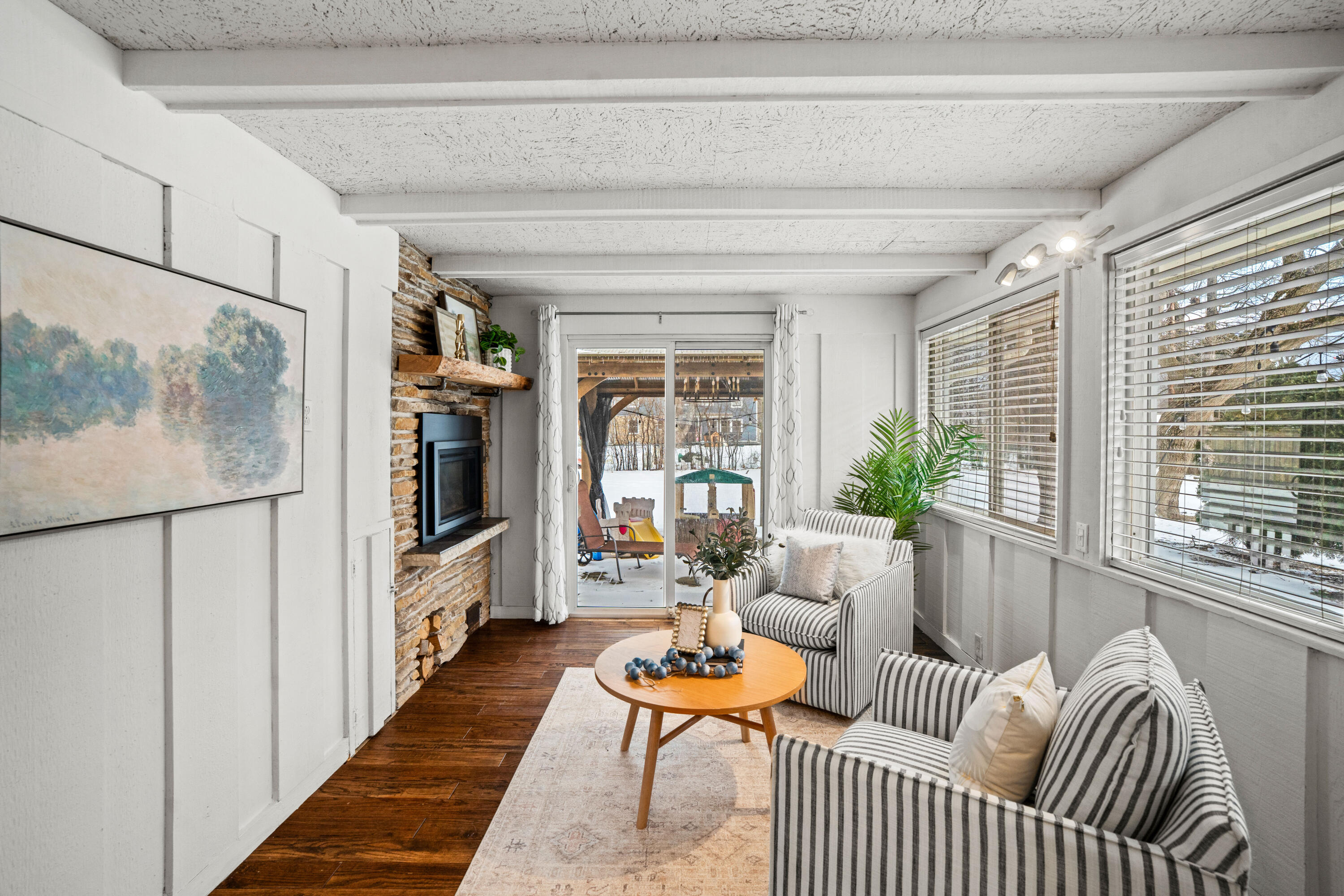 8930 North Maitland Road Bayside, WI 53217 - Photo 12 of 47 Electric Fireplace is turned on with one click of a remote and has the ability to heat a very large area. Slider lead to patio with gazebo.