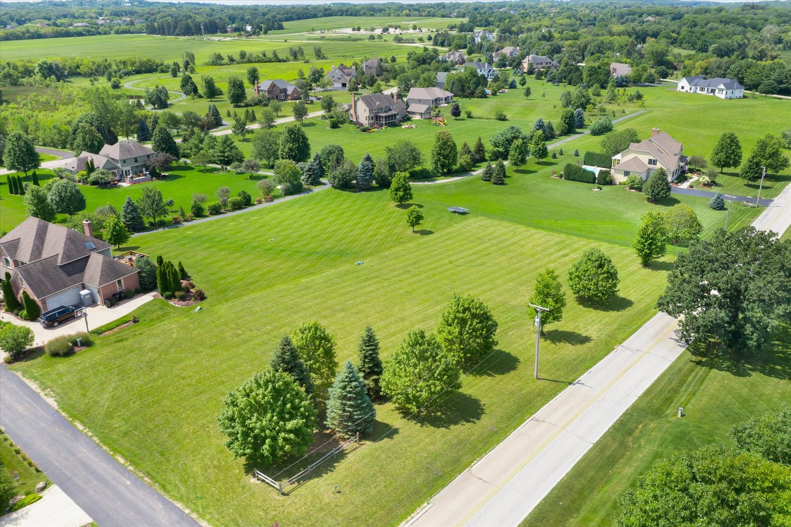 41-w099 Brown Road St. Charles, IL 60175 - Photo 1 of 10 a view of a garden with a lake
