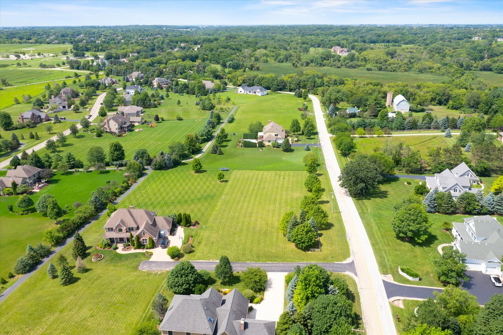 41-w099 Brown Road St. Charles, IL 60175 - Photo 2 of 10 an aerial view of lake residential houses with outdoor space and swimming pool