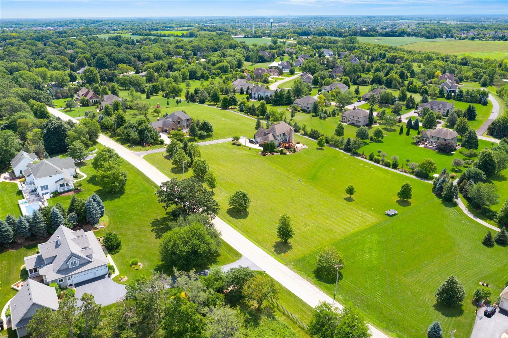 41-w099 Brown Road St. Charles, IL 60175 - Photo 5 of 10 an aerial view of residential houses with outdoor space and swimming pool