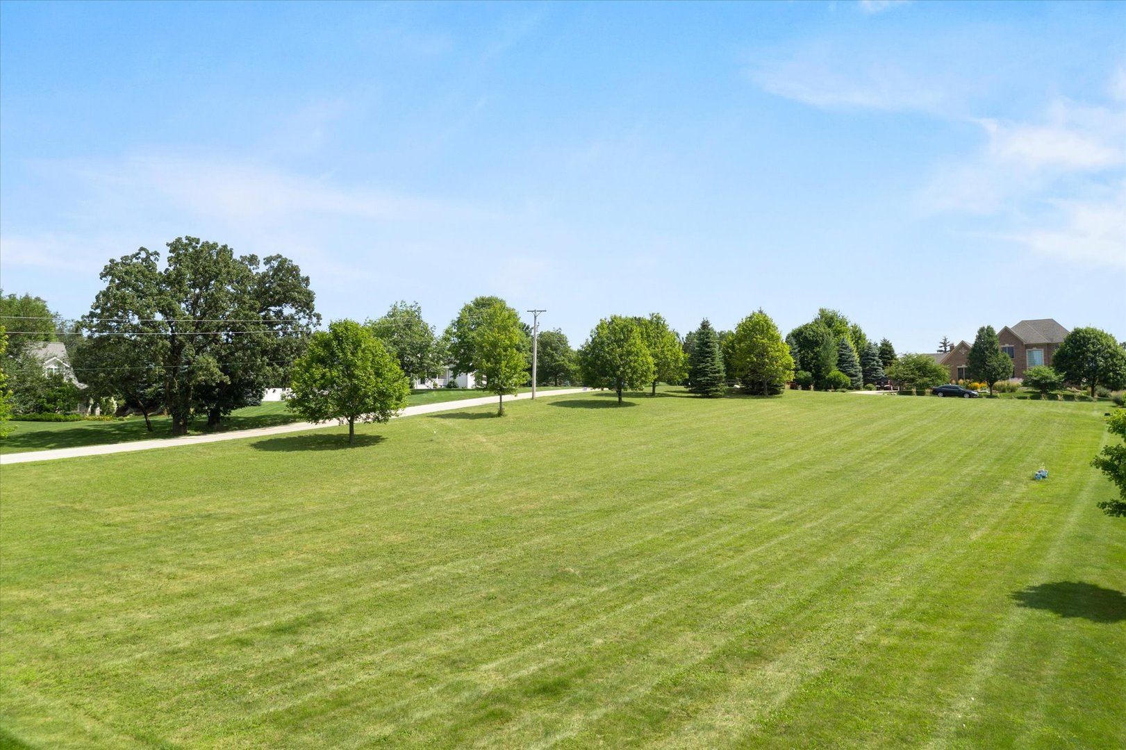 41-w099 Brown Road St. Charles, IL 60175 - Photo 7 of 10 a view of a golf course with a lake