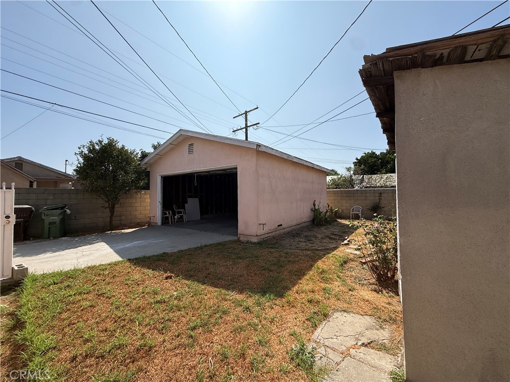 2035 North Grandee Avenue Compton, CA 90222 - Photo 19 of 21 a front view of a house with a yard