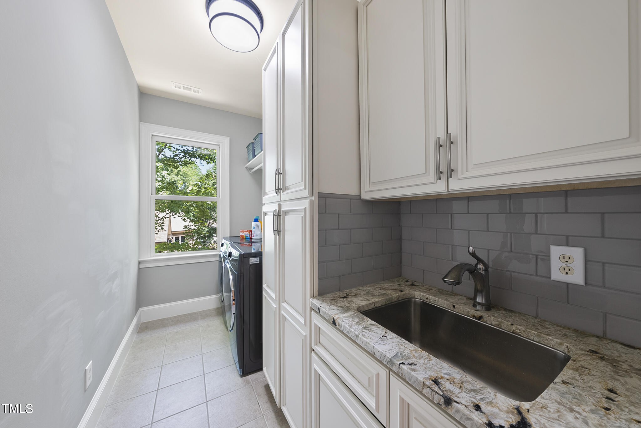 8412 Norman Estates Way Raleigh, NC 27613 - Photo 66 of 77 2nd floor laundry with sink