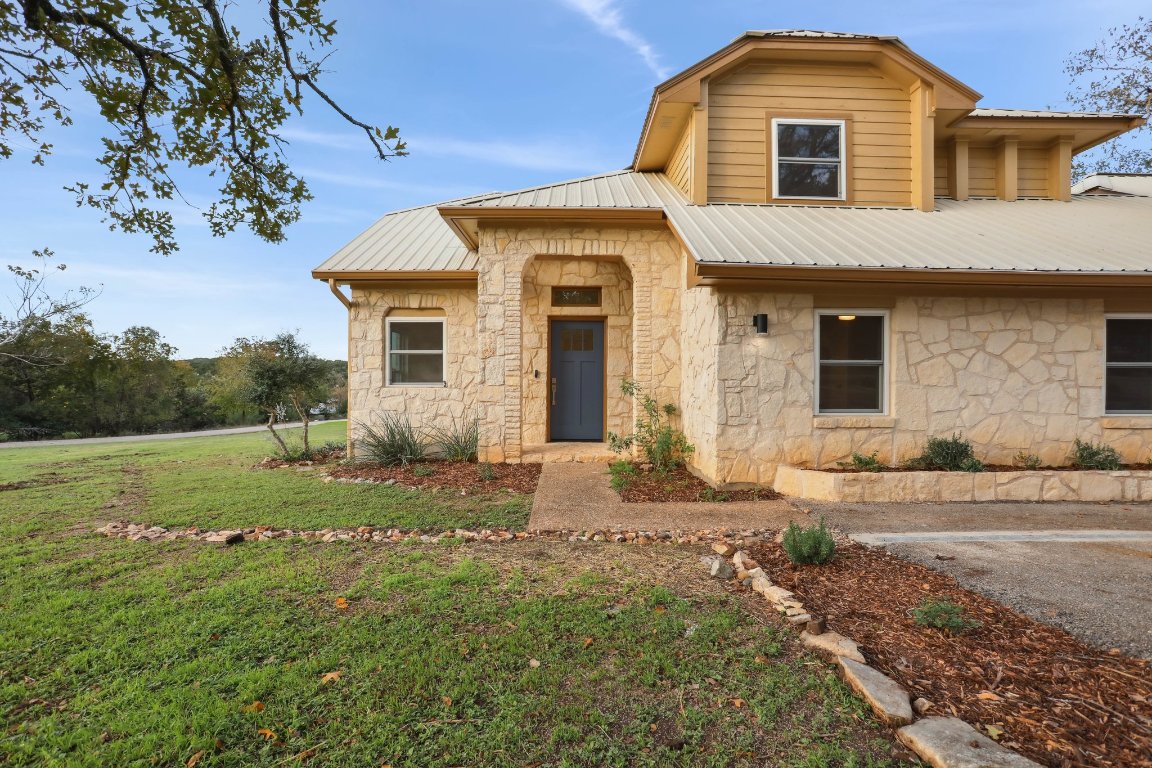 4 Concord Circle Austin, TX 78737 - Photo 1 of 25 a front view of a house with a yard