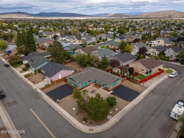 an aerial view of residential houses with outdoor space