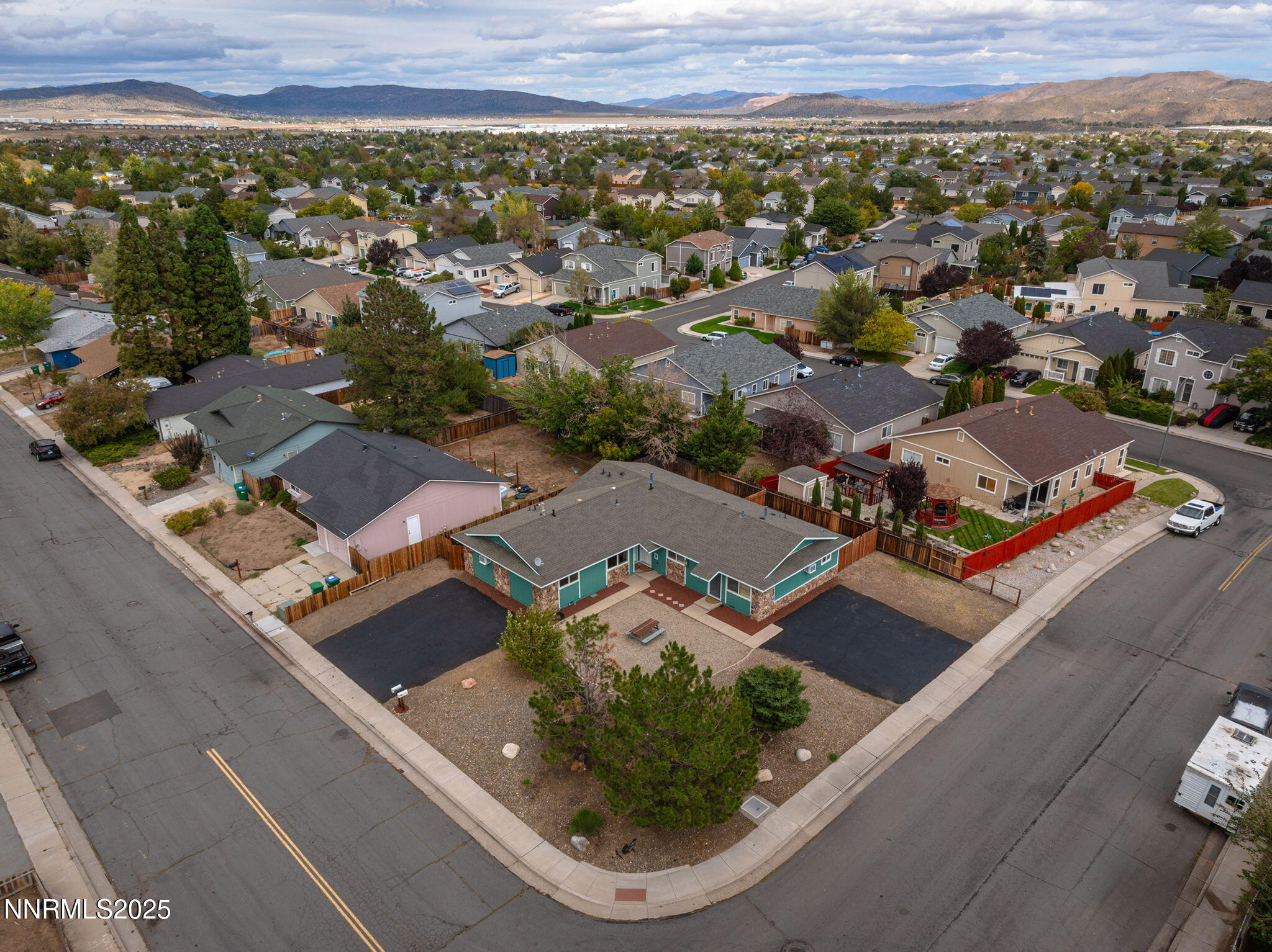an aerial view of residential houses with outdoor space