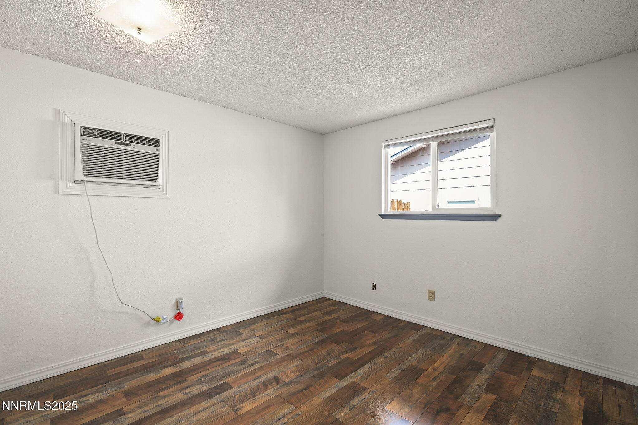 10005 Sagewood Drive Reno, NV 89506 - Photo 14 of 43 a view of a room with wooden floor and window