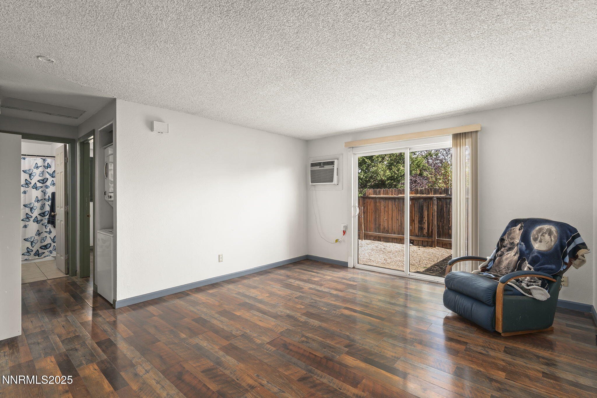 10005 Sagewood Drive Reno, NV 89506 - Photo 25 of 43 an empty room with wooden floor and windows