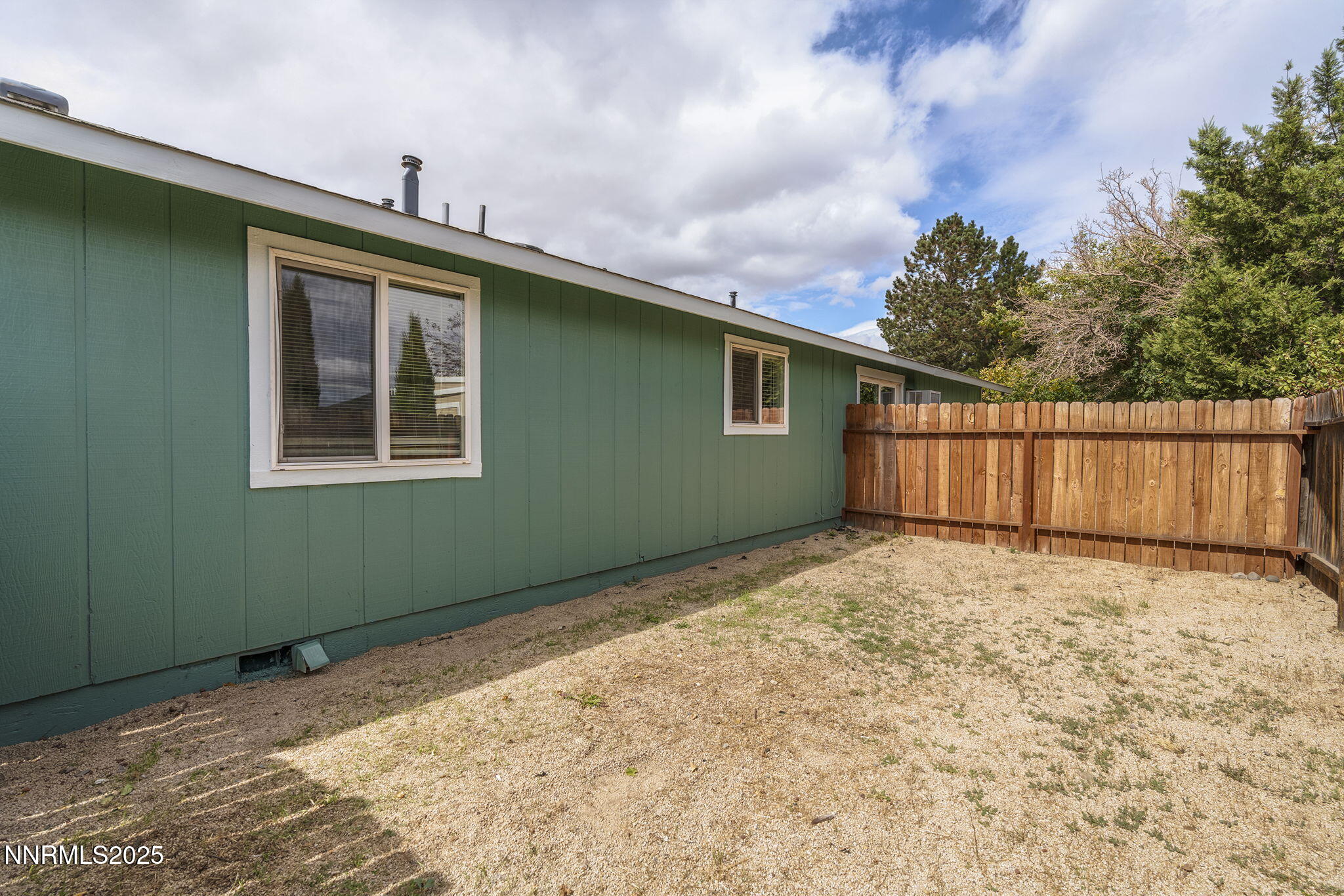 10005 Sagewood Drive Reno, NV 89506 - Photo 34 of 43 a view of a backyard with wooden fence
