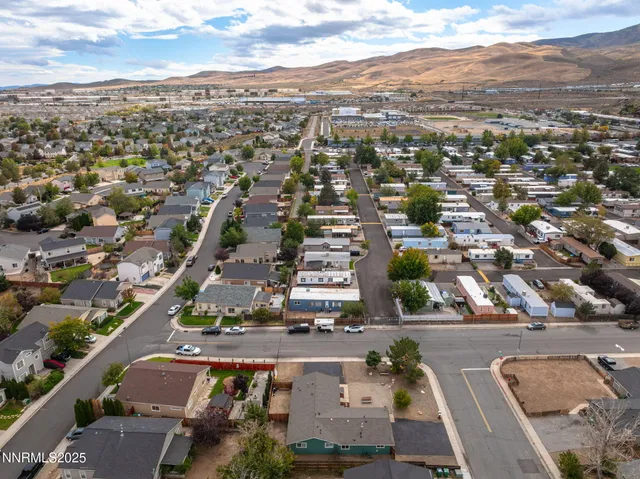 an aerial view of residential houses with outdoor space