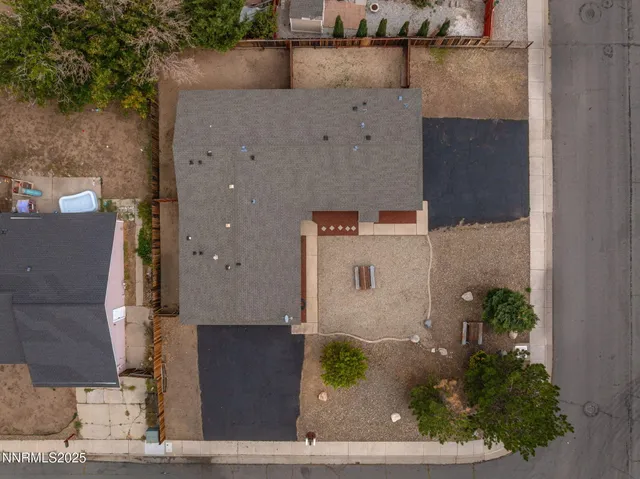 an aerial view of residential house with outdoor space and parking