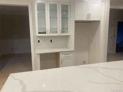 a bedroom with a bed and a cabinets