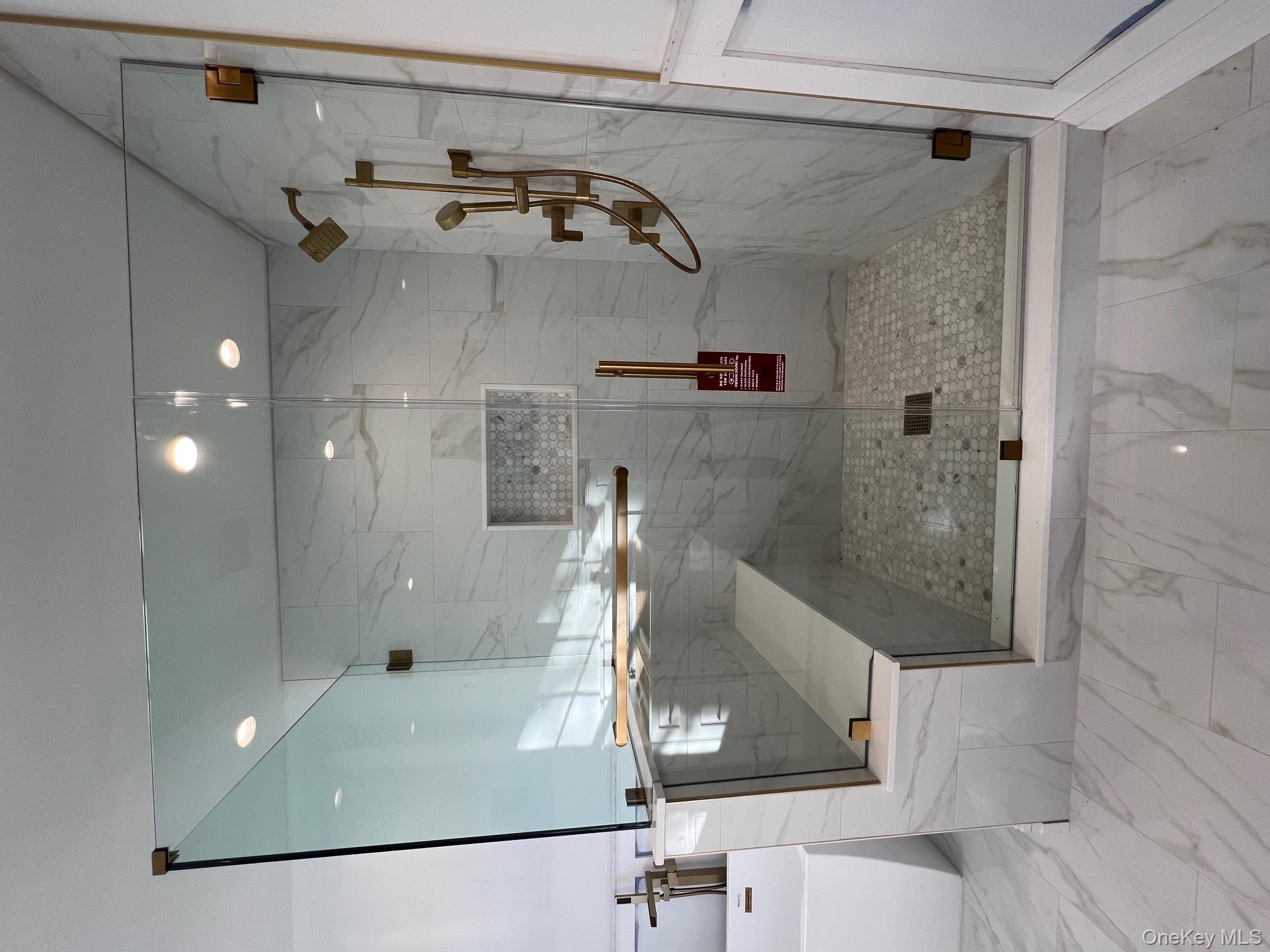 7 Greenway Circle Syosset, NY 11791 - Photo 7 of 10 Full bath with marble finish flooring, a marble finish shower, a freestanding tub, and recessed lighting