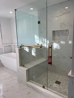 a bathroom with a shower and a sink