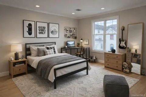 a bedroom with a bed couch and window