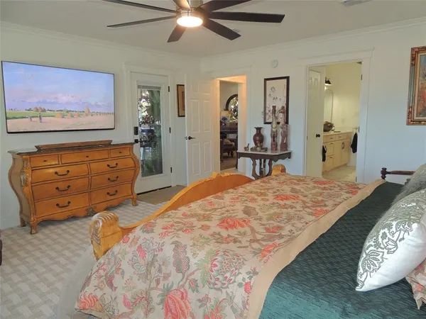 a view of walk in closet and bathroom