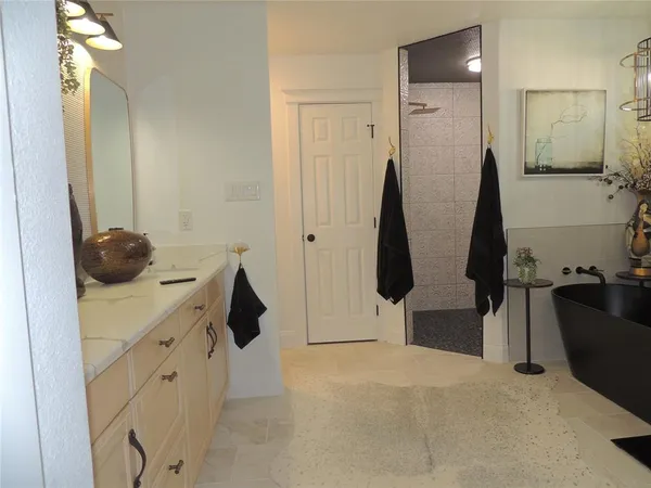 a living room with fireplace furniture and a chandelier