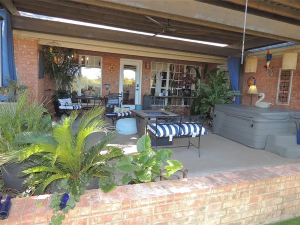 a view of living room with furniture and a large window