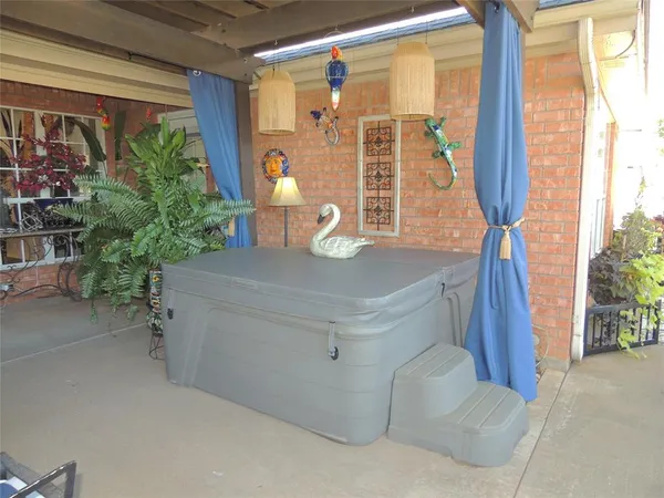 a backyard of a house with table and chairs