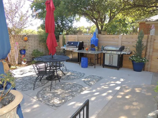 a view of a backyard with potted plants