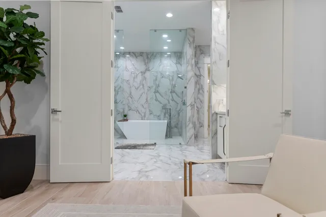 a bathroom with a bathtub and shower