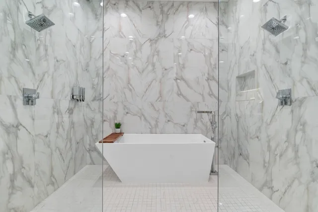 a white bath tub sitting in a bathroom
