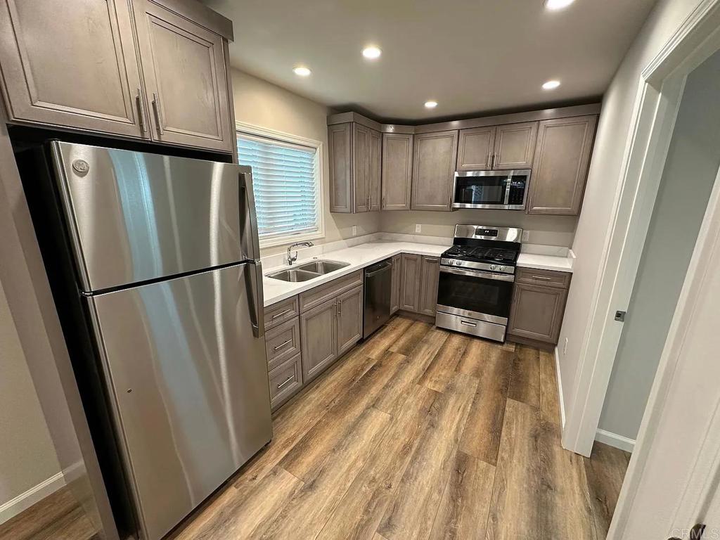 3621 Chestnut Street Lafayette, CA 94549 - Photo 4 of 18 a kitchen with stainless steel appliances granite countertop refrigerator sink and cabinets