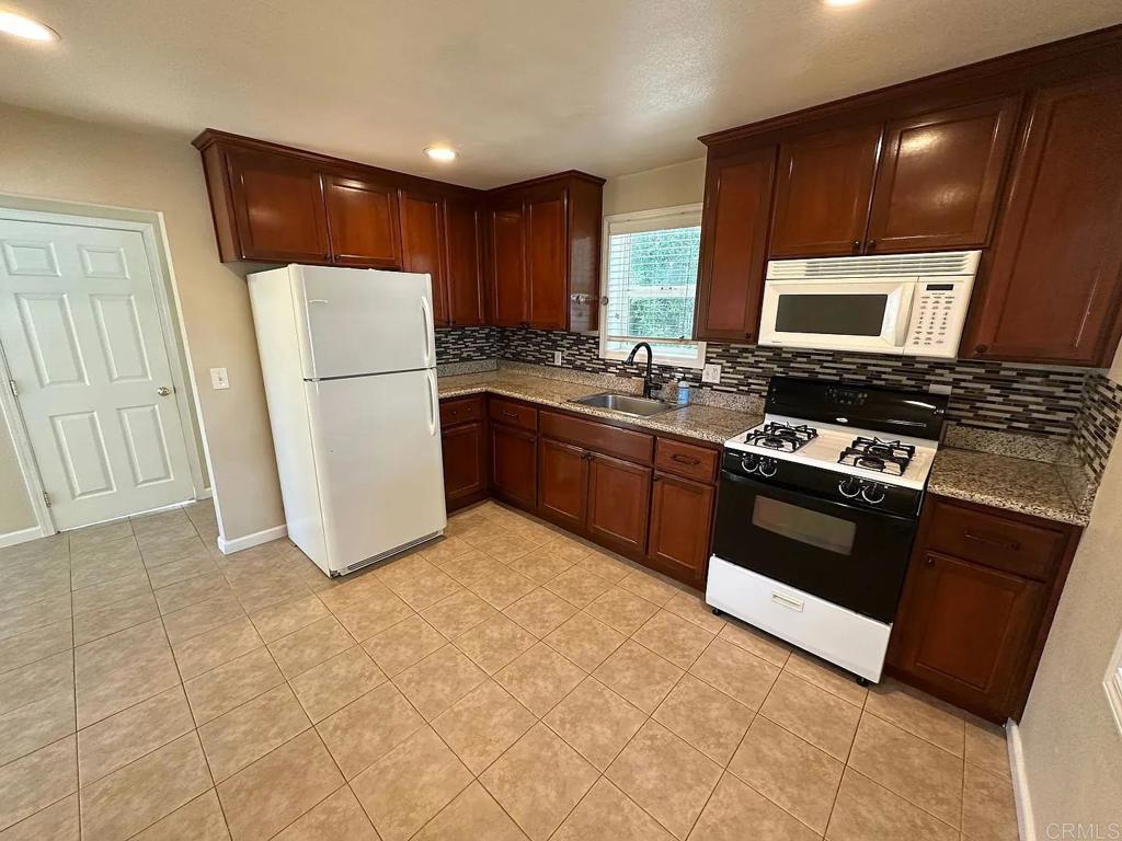 3621 Chestnut Street Lafayette, CA 94549 - Photo 8 of 18 a kitchen with stainless steel appliances granite countertop a refrigerator stove and sink