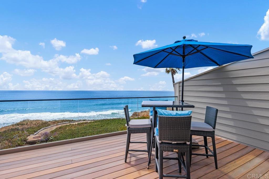 1856 Parliament Road Encinitas, CA 92024 - Photo 1 of 42 a view of table and chairs under an umbrella