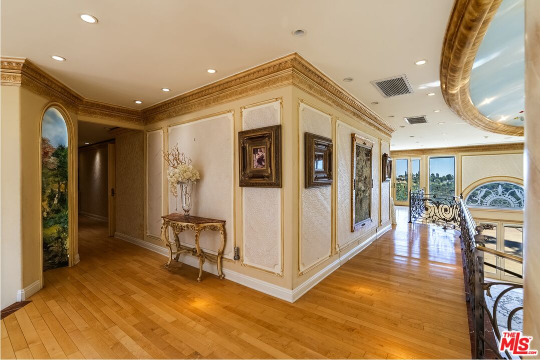 2716 Casiano Road Los Angeles, CA 90077 - Photo 11 of 21 a view of a livingroom with furniture and a ceiling fan