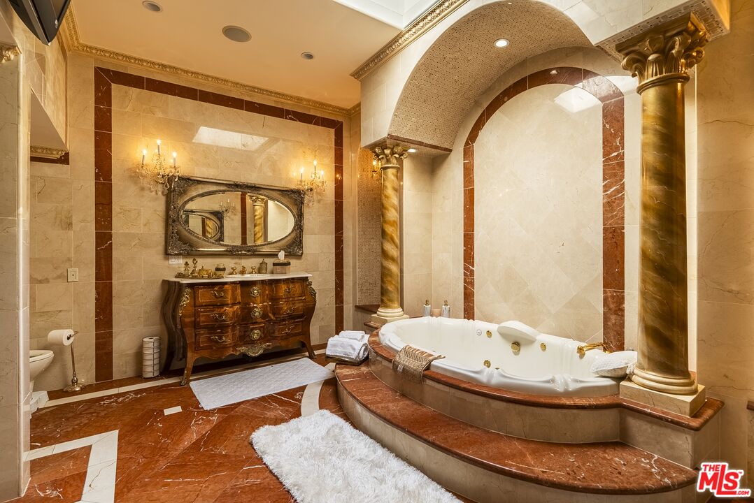 2716 Casiano Road Los Angeles, CA 90077 - Photo 14 of 21 a bathroom with a tub and a shower