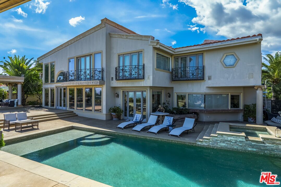 2716 Casiano Road Los Angeles, CA 90077 - Photo 15 of 21 a front view of a house with swimming pool having outdoor seating