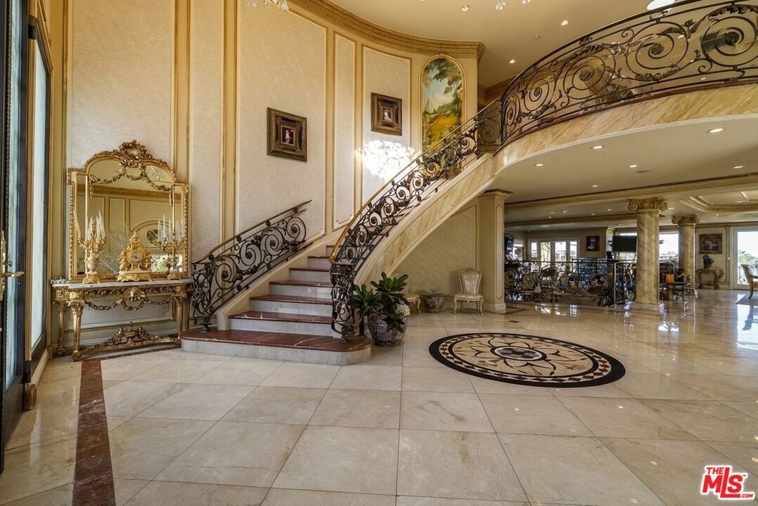 2716 Casiano Road Los Angeles, CA 90077 - Photo 3 of 21 a view of a livingroom with furniture and staircase