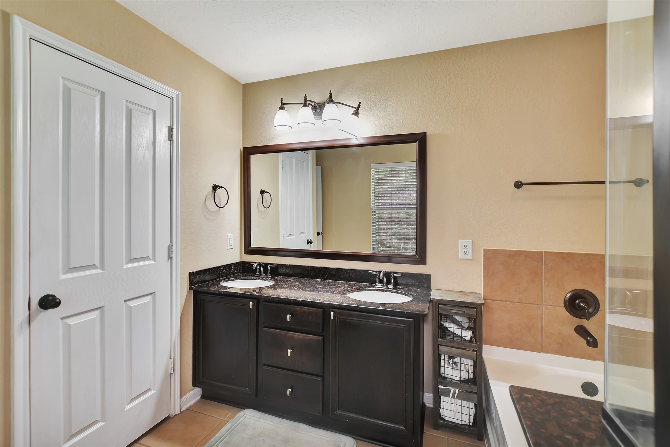 9706 Lockhart Reach Lane Humble, TX 77396 - Photo 15 of 25 a bathroom with a sink and a mirror