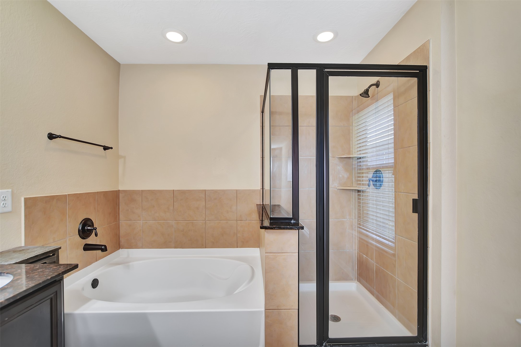 9706 Lockhart Reach Lane Humble, TX 77396 - Photo 16 of 25 a bathroom with a bathtub and shower
