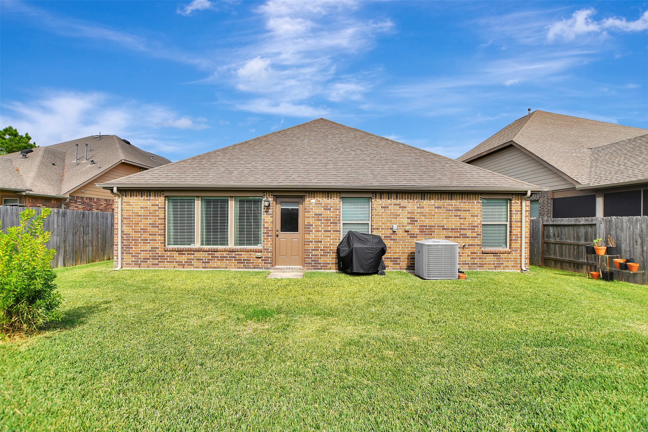 9706 Lockhart Reach Lane Humble, TX 77396 - Photo 25 of 25 a view of a house with backyard porch and sitting area