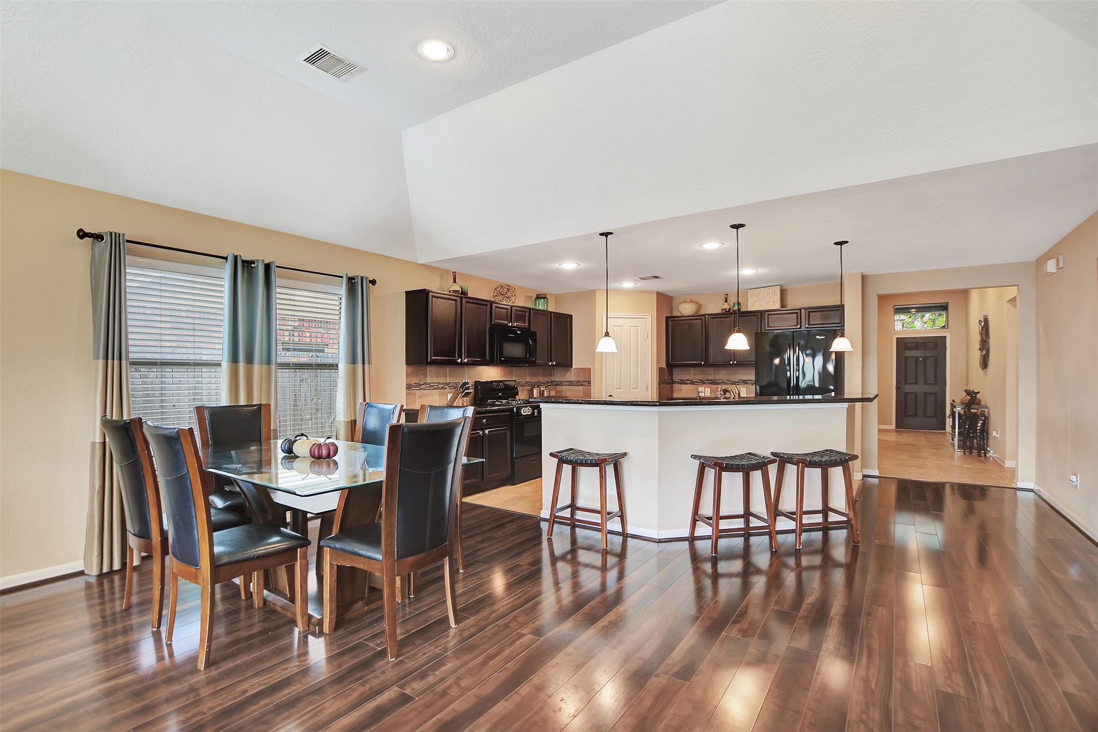 9706 Lockhart Reach Lane Humble, TX 77396 - Photo 8 of 25 a dining room with furniture and wooden floor