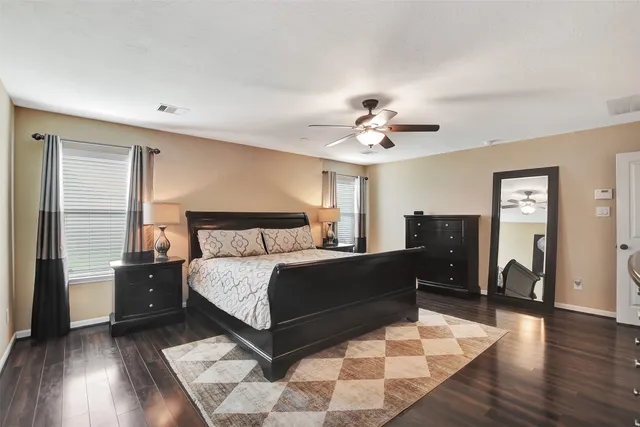 a bed room with a bed and a chandelier