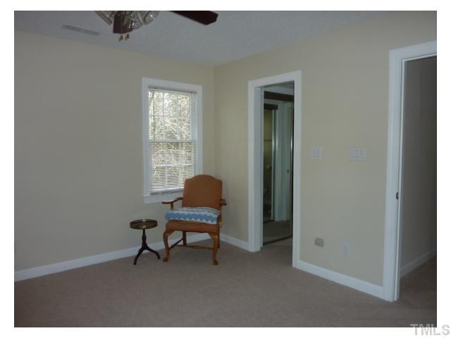 5407 Fortunes Ridge Drive Durham, NC 27713 - Photo 12 of 22 a workspace room with hardwood table chair and windows