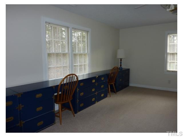 5407 Fortunes Ridge Drive Durham, NC 27713 - Photo 15 of 22 a room with a dresser and a window