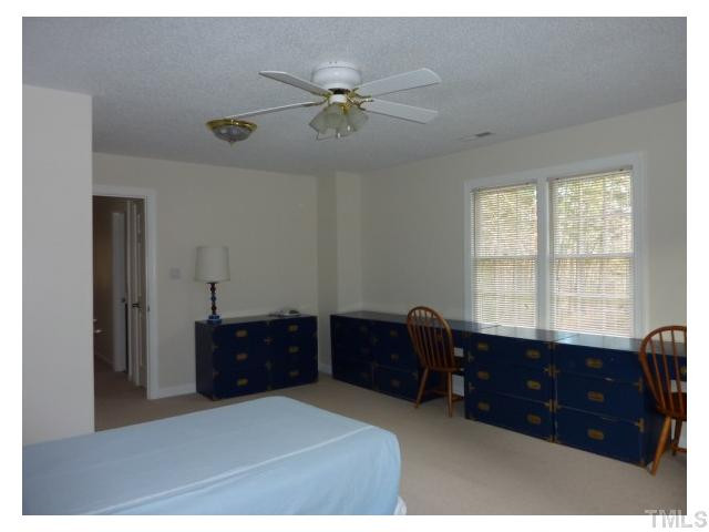 5407 Fortunes Ridge Drive Durham, NC 27713 - Photo 16 of 22 a bed room with a bed and a window