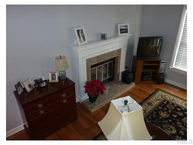 5407 Fortunes Ridge Drive Durham, NC 27713 - Photo 9 of 22 a living room with furniture and a fireplace