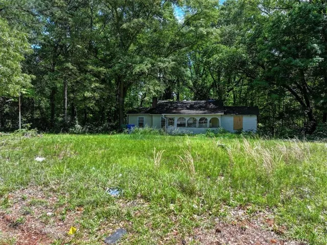 a backyard of a house with lots of green space