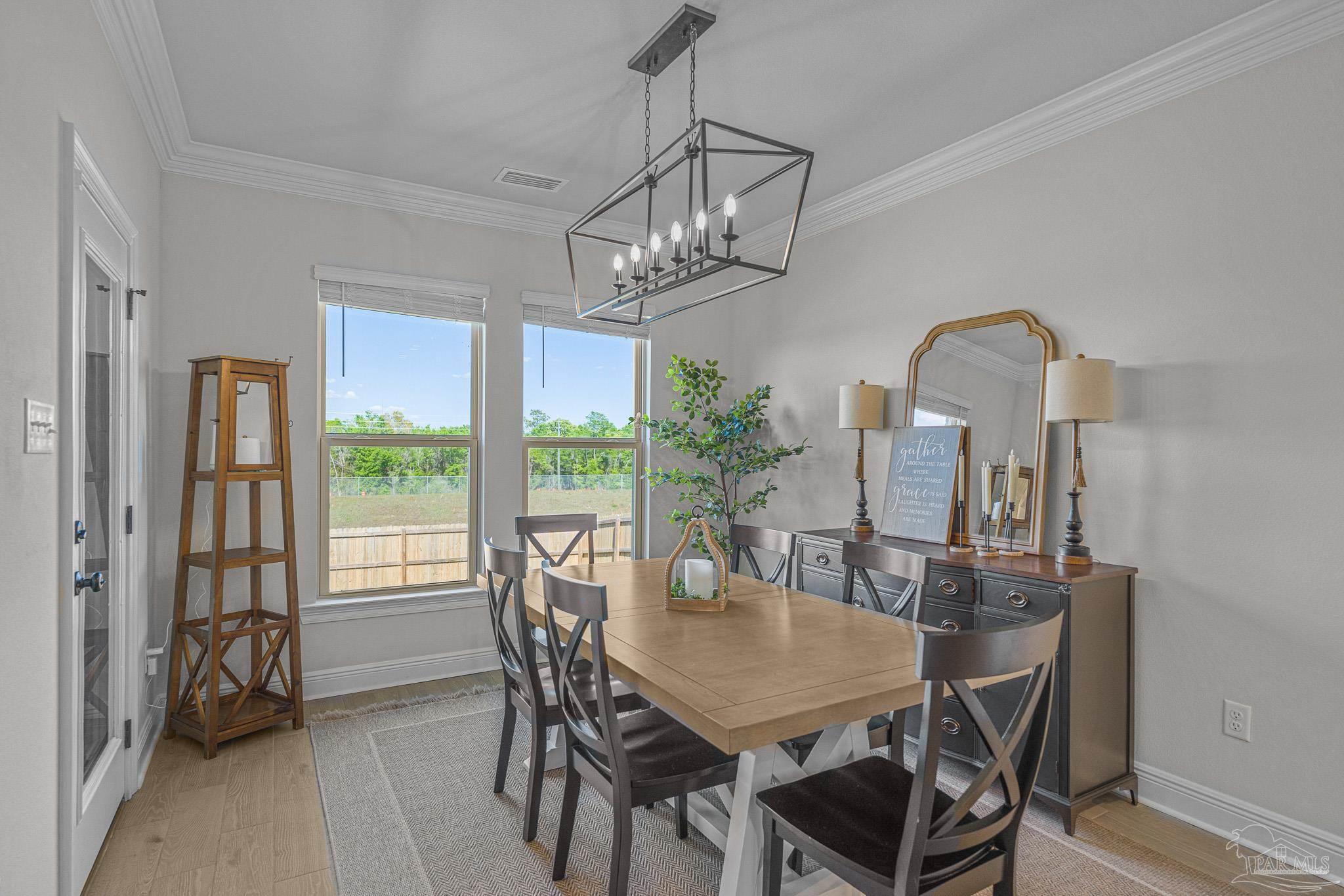 5380 Adeline Circle Pace, FL 32571 - Photo 13 of 35 a view of a dining room with furniture window and outside view