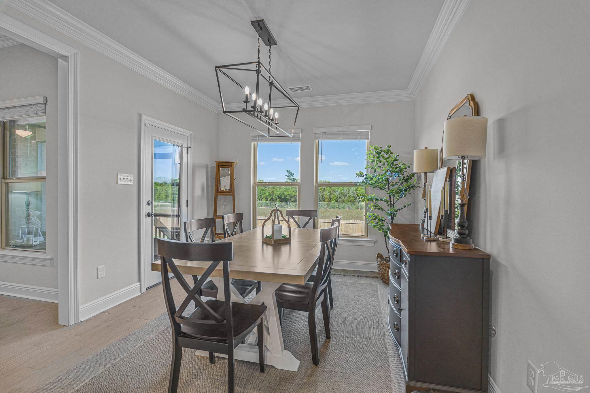 5380 Adeline Circle Pace, FL 32571 - Photo 14 of 35 a view of a dining room with furniture window and outside view