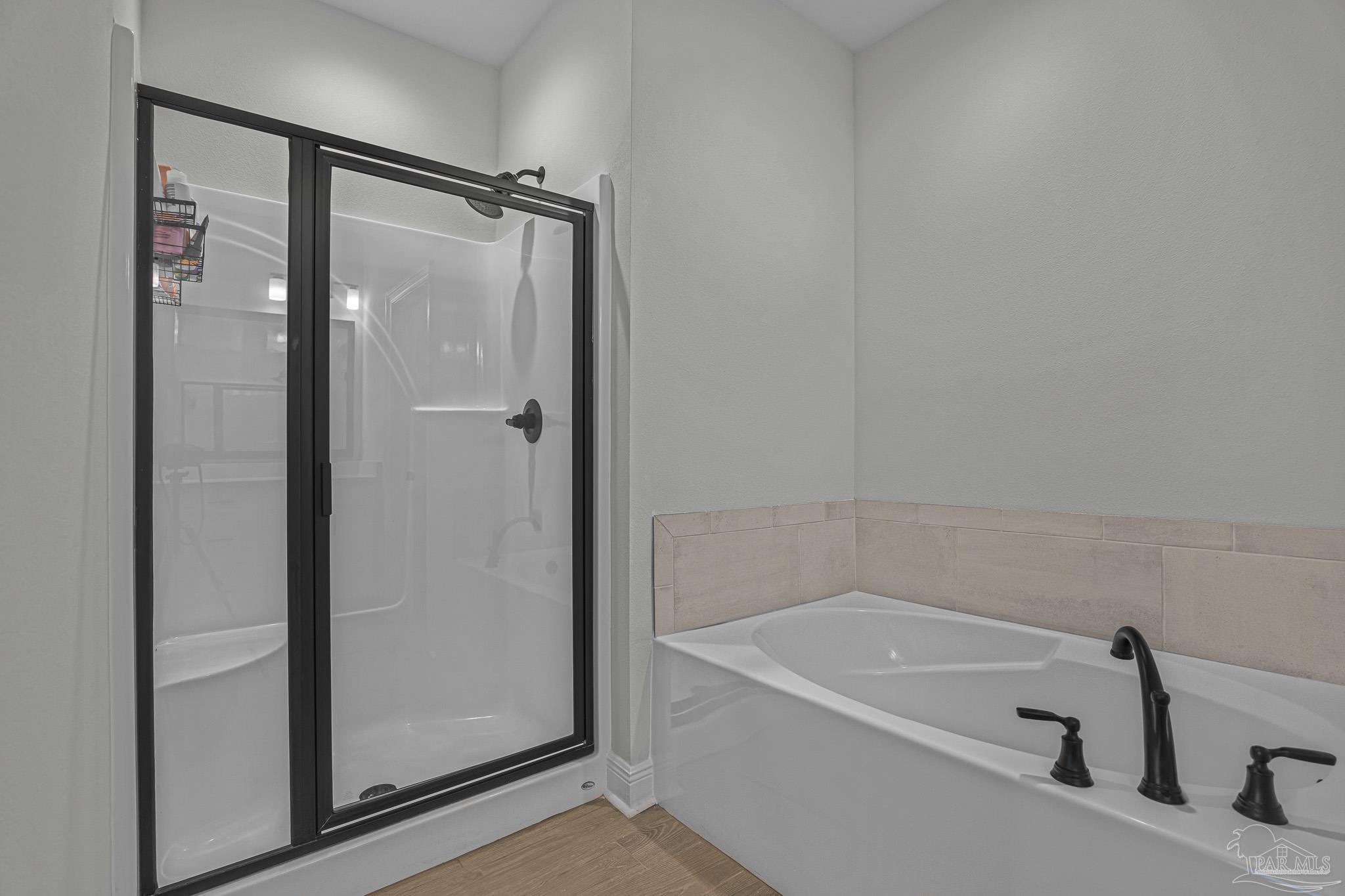 5380 Adeline Circle Pace, FL 32571 - Photo 19 of 35 a bathroom with a tub and a shower