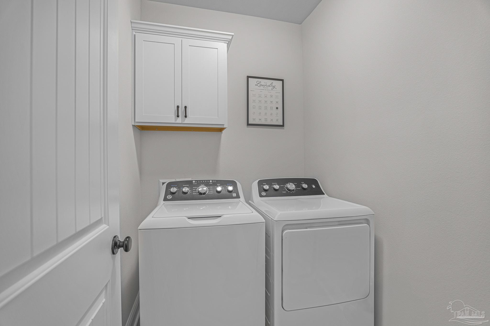 5380 Adeline Circle Pace, FL 32571 - Photo 27 of 35 a utility room with dryer and washer