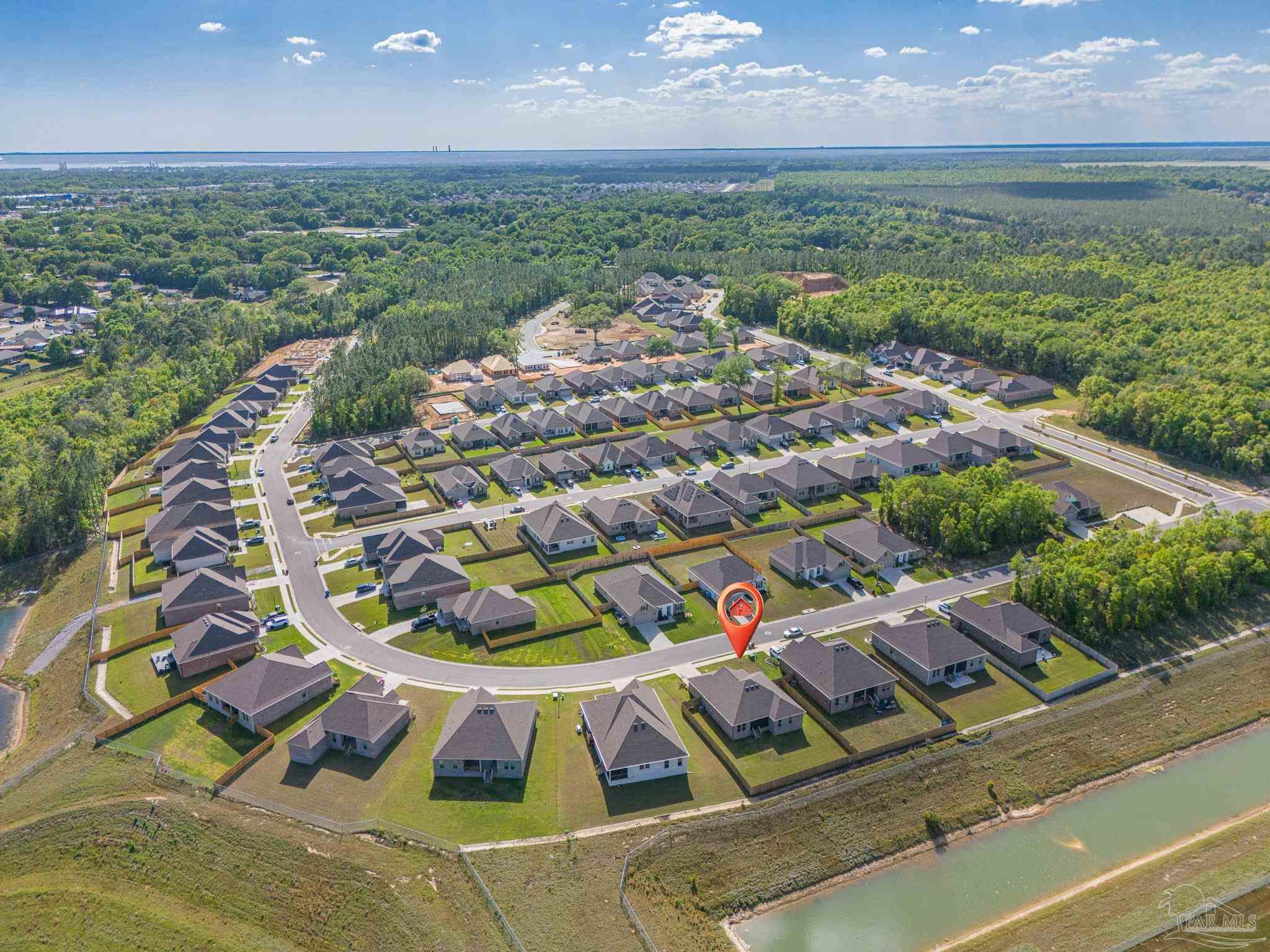 5380 Adeline Circle Pace, FL 32571 - Photo 33 of 35 a view of a swimming pool with a yard