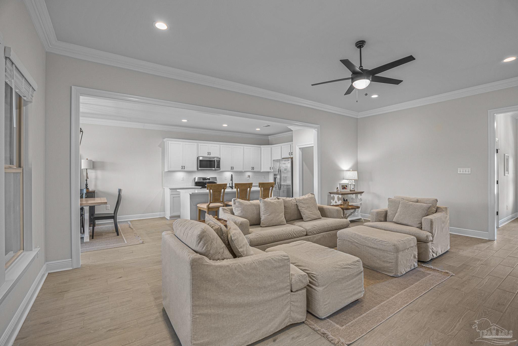 5380 Adeline Circle Pace, FL 32571 - Photo 8 of 35 a living room with furniture and a view of kitchen