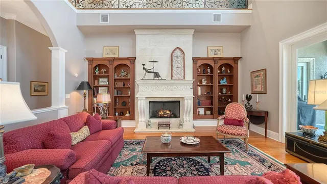 a very nice looking living room with kitchen island furniture and a view of kitchen